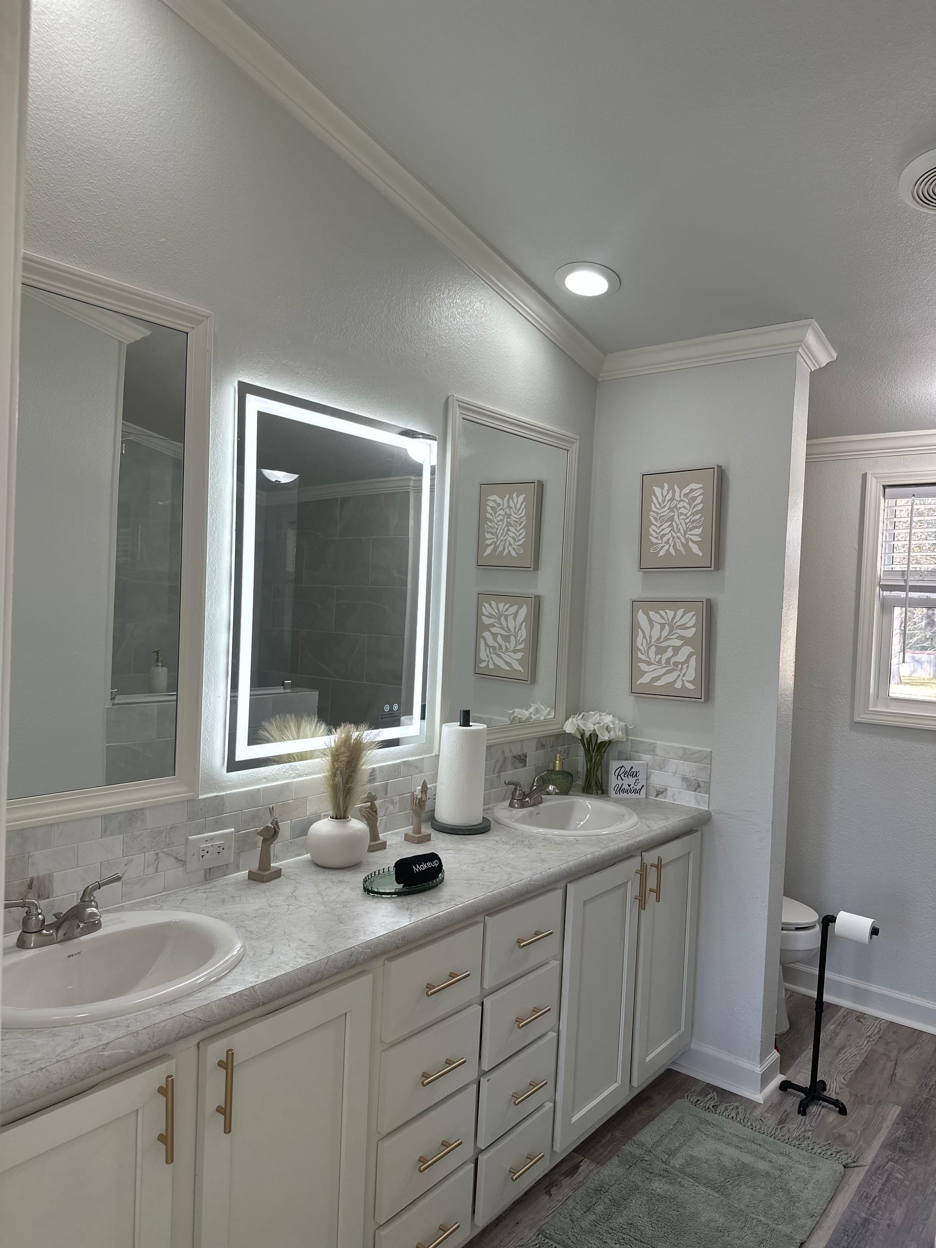 Bathroom with bidet and towel warmers