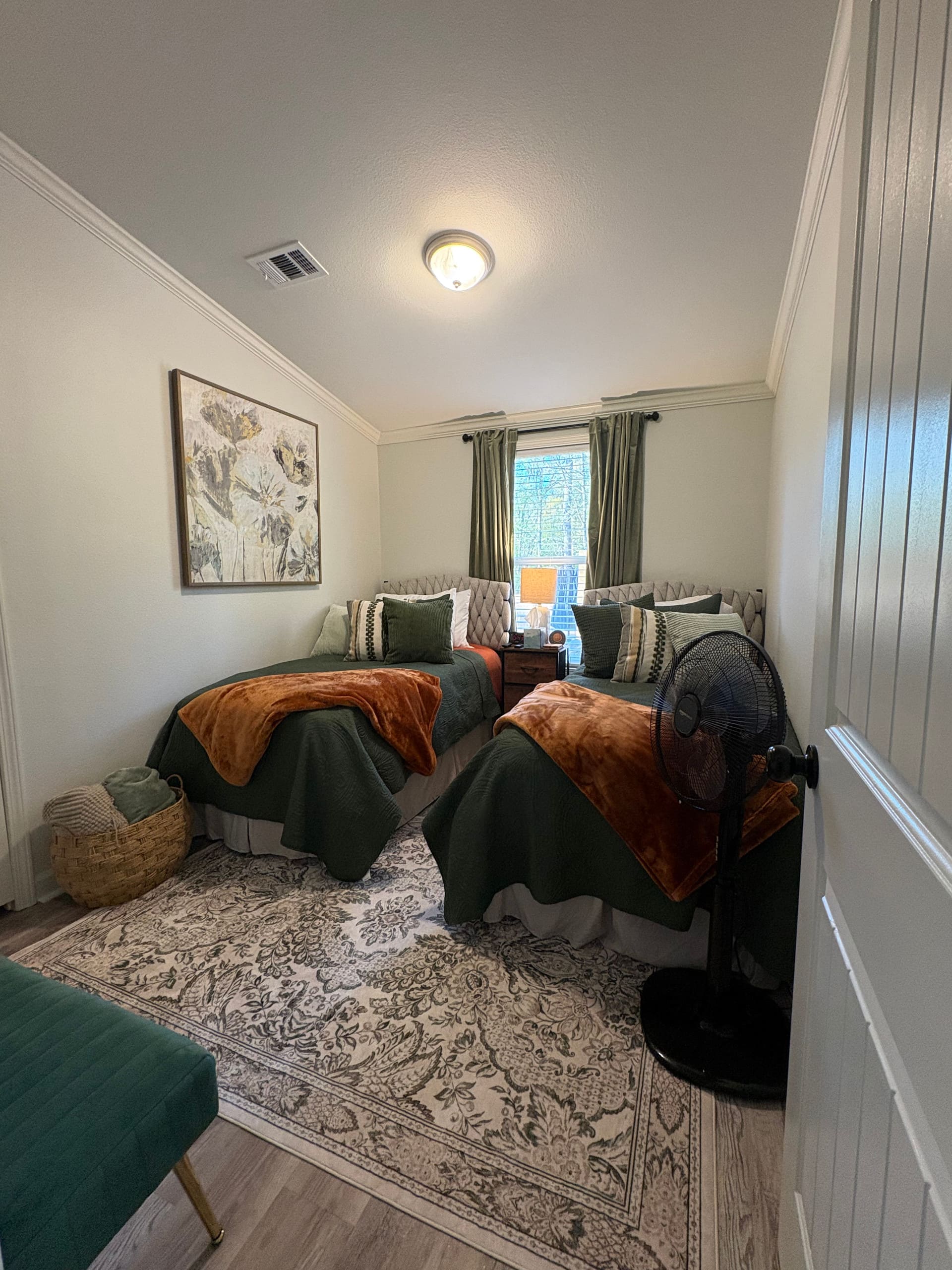 Bedroom with comfortable bedding and natural light