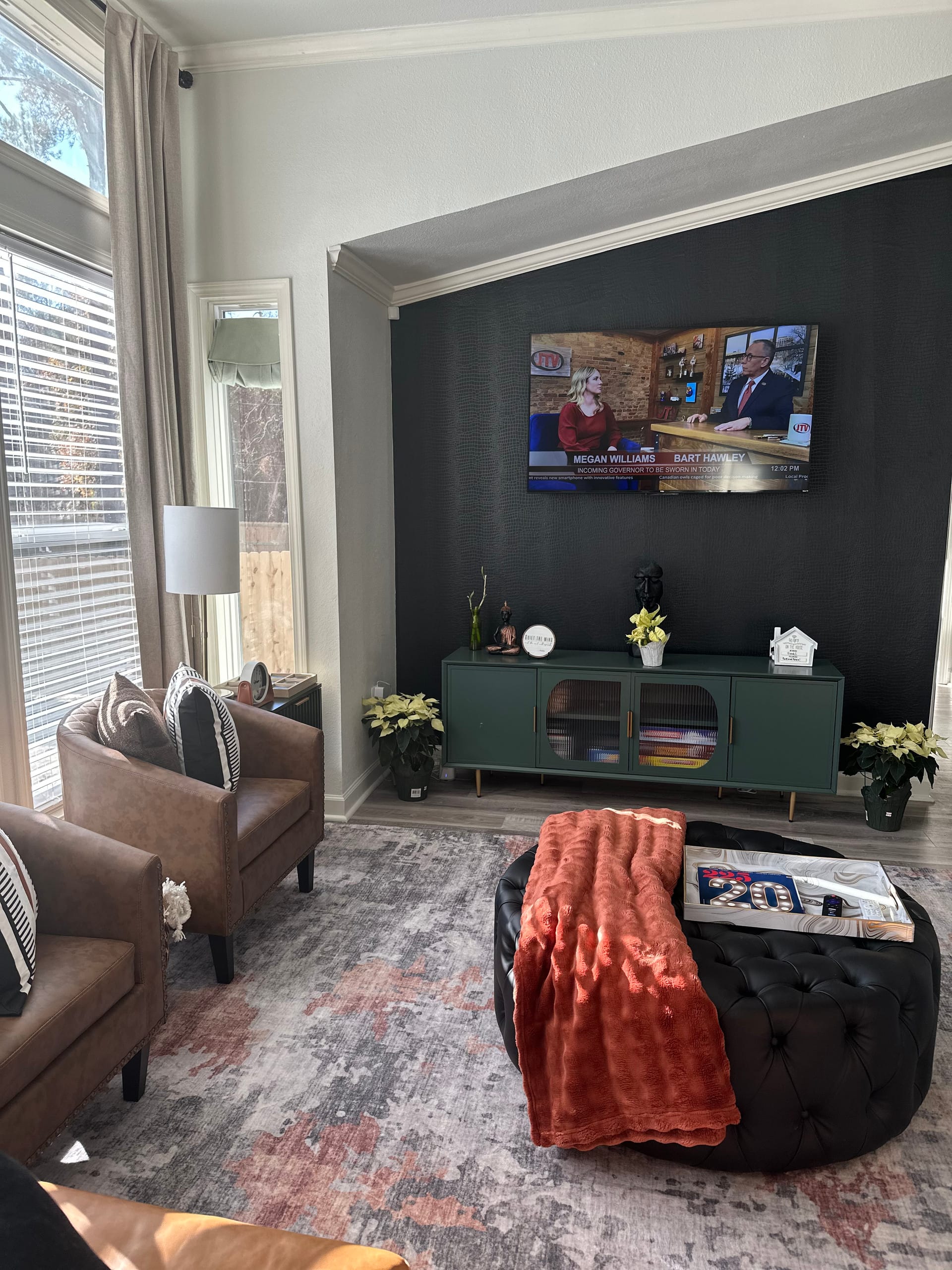 Spacious living area with king bed and decor